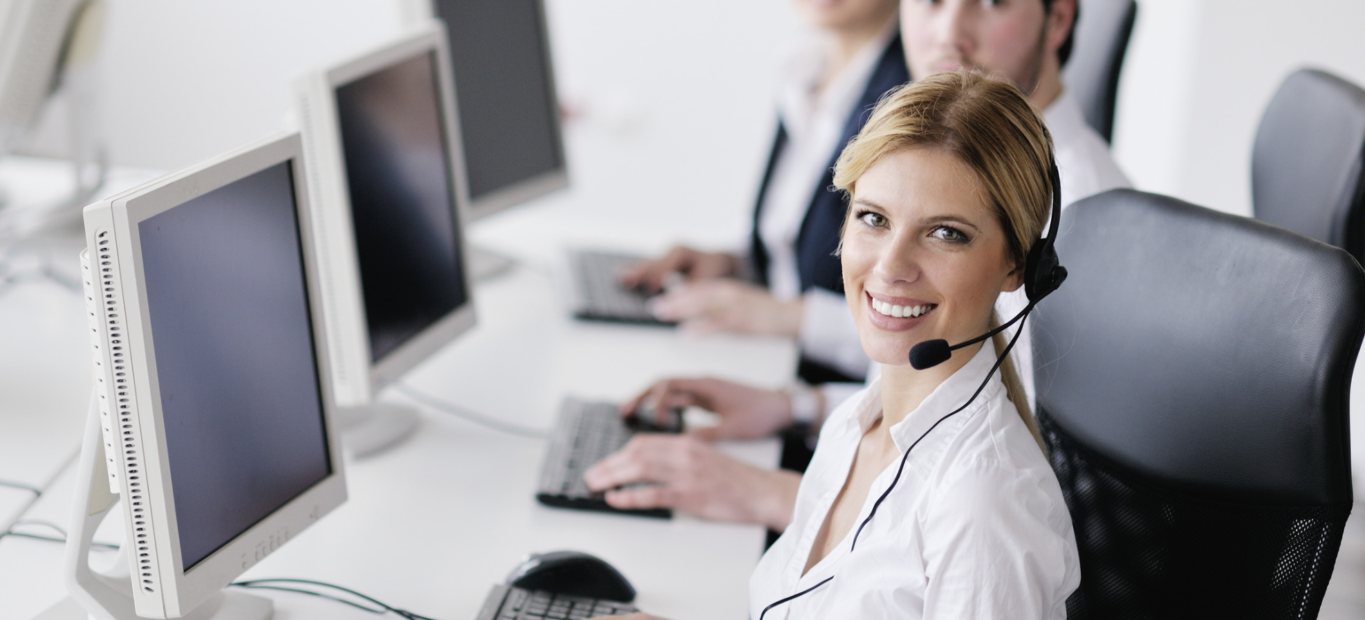 A team member wearing a headset, ready to assist